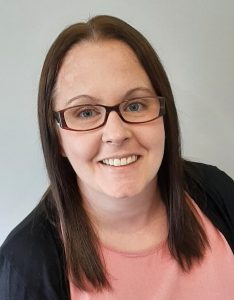 Headshot of Helen Young, a smiling woman with a warm and approachable expression.